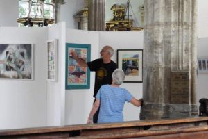 Hanging paintings at the Summer Exhibition